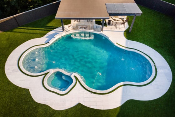 Freeform swimming pool with natural curved design in Houston